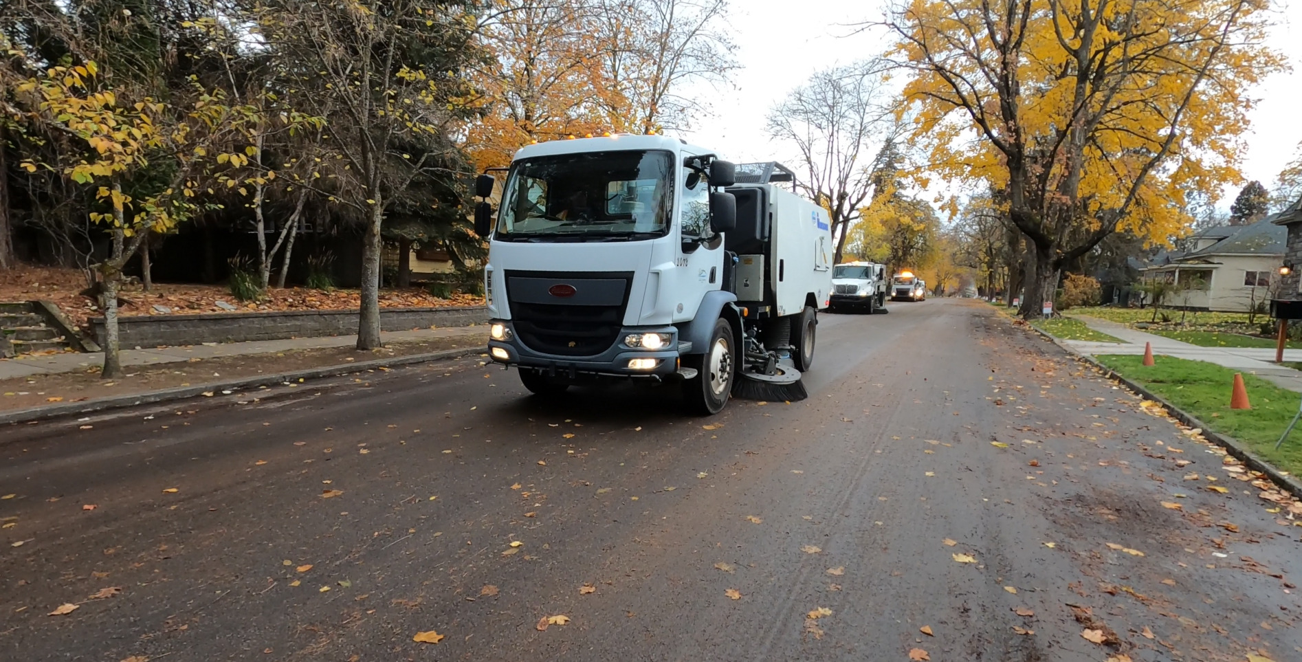 City of Coeur d'Alene street sweepers cleaning a road.